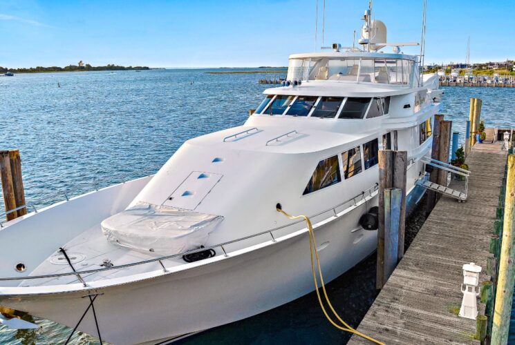 Bow of white yacht named Lady Grace docked in a marina