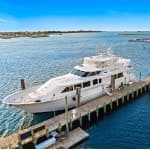 White yacht named Lady Grace docked in a marina