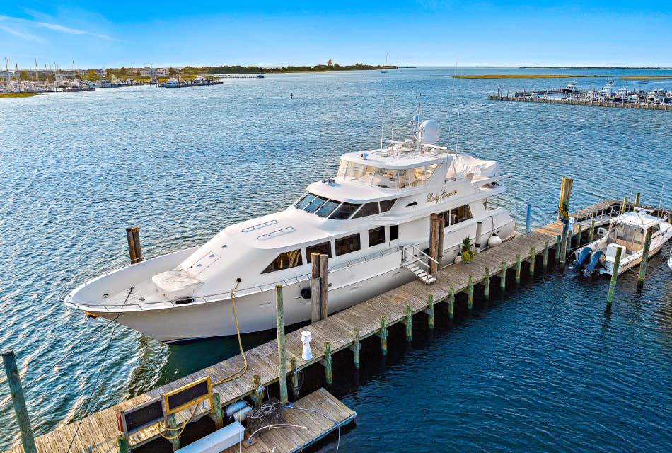 White yacht named Lady Grace docked in a marina